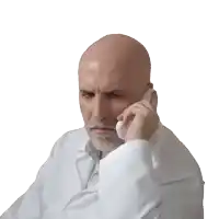 a man with a beard is talking on a cell phone