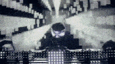 a man in a mask is playing music in front of a screen that says ' ninja '