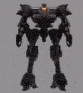 a shadow of a robot with a light coming out of its head .