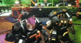 two robots are standing next to each other in a video game