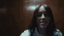 a blurry picture of a man 's face in a dark room with lights behind him