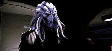 a close up of a monster with red eyes
