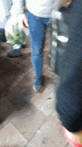 a blurry picture of a person walking with a bag of vegetables