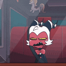 a cartoon character is sitting in a car with a unicorn on the ceiling