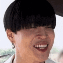 a close up of a person 's face with a funny face .