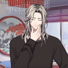 a man with long white hair has his eyes closed and his hand on his chin