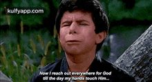 a young man is crying and says `` now i reach out everywhere for god till the day my hands touch him . ''