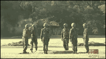 a group of soldiers are standing in a field with the website 4gifs.com visible in the corner