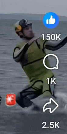 a man in a green wetsuit is jumping in the water with a blue thumbs up icon