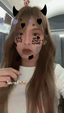 a girl with a mask on her face that says bad girl go every where