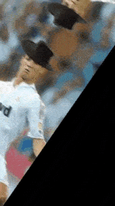 a soccer player wearing a top hat throws a ball