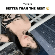 a woman is laying on her back on a balcony with the caption this is better than the rest