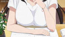 a woman is sitting at a desk with a book open and the words nddds sama written on the bottom