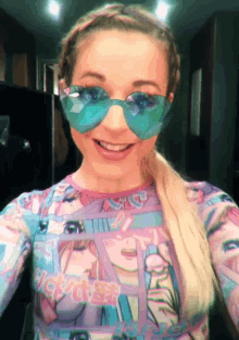 a woman wearing sunglasses and a shirt that says ' i love you ' on it