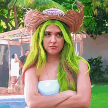 a woman with green hair and a cowboy hat