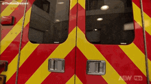 a red and yellow ambulance with the words new tbs written on the bottom