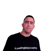 a man wearing a black leading with creativity shirt