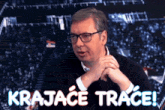 a man with glasses and the words krajace trace on the bottom