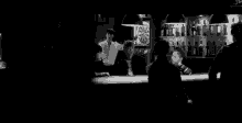 a man sitting at a bar with a sign that says beer and drink