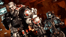 a man with a beard stands next to another man in a futuristic outfit