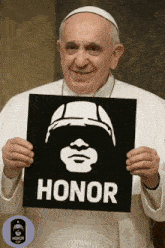 a man holds up a sign that says honor