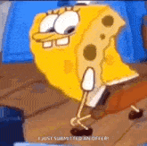 spongebob squarepants is standing on a wooden floor with a piece of cheese on his head .