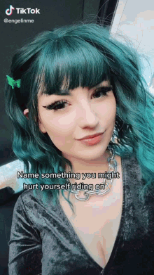 a woman with green hair has a butterfly clip in her hair and a caption that says name something you might hurt yourself riding on