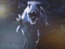 a painting of a monster with its mouth open standing in the grass .