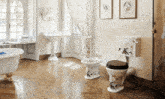 a bathroom with two toilets and a bidet