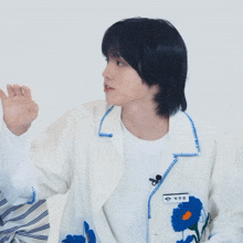 a man wearing a white jacket with a name tag that says ' eun ' on it