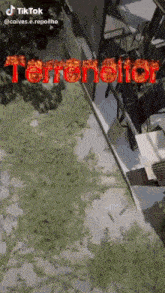a cartoon drawing of a building with the word terranator written on it .