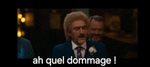 a man in a suit and tie says ah quel dommage !