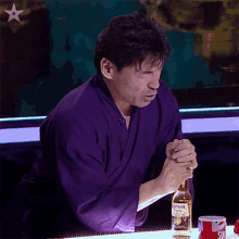 Opening A Bottle Of Beer Keiichi Iwasaki GIF - Opening A Bottle Of Beer Keiichi Iwasaki Britains Got Talent GIFs