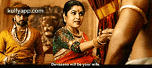a woman in a red saree is talking to a man in a yellow shirt ..