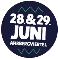a blue circle with white text that says 28.&29. juni