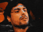 a close up of a man 's face with the letters sb visible