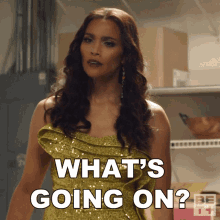 a woman in a gold sequined dress says what 's going on