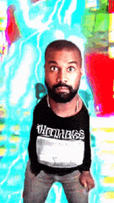 a man with a beard is wearing a black shirt that says vintages on the front