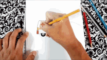 a person drawing an ambulance with a red cross on the side