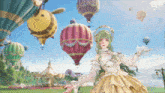 a girl in a gold dress is standing in front of a bunch of hot air balloons