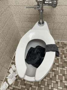 a toilet with a towel on the seat