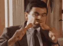 Eating Chicken - Mr. Bean GIF - Mr Bean Rowan Atkinson Goofy GIFs