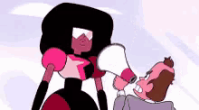 a cartoon character is holding a megaphone next to a man .