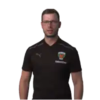 a man wearing a black shirt that says fuchsl on it
