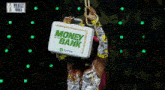 a woman is holding a briefcase that says money on the bank on it