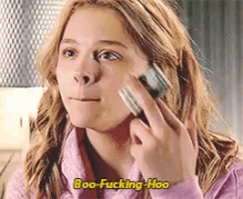 a girl is talking on a cell phone with the words boo-fucking-hoo written above her