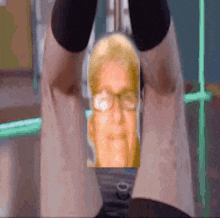 a pixelated image of a person 's legs with a man 's head visible