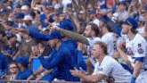 a group of mets baseball players are sitting in the dugout