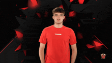 a man in a red shirt flexing his muscles