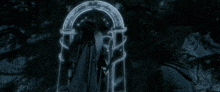 a man with a beard is standing in front of a glowing door with writing on it .